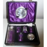A CASED COMMUNION SET, silver plated, the interior lined with silk and velvet, box 8 x 5 x 2.5