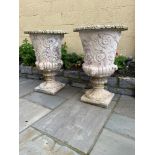 A PAIR OF STONE URNS, 94cm high approx, 63cm across the top.