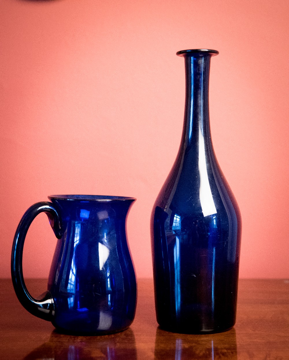 A GEORGIAN BRISTOL GLASS BOTTLE WITH TANKARD, c.1790, tankard signed Bristol, bottle 11in, tankard