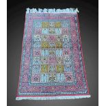A FINE PERSIAN SILK QUM RUG, Aliabad, Qum, hand woven over twelve months on a hand loom by Aliabad