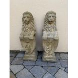 A PAIR OF STONE LIONS HOLDING SHIELDS, 82cm high approx