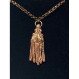 A VINTAGE 9CT YELLOW GOLD TASSEL PENDANT, on a 9ct yellow gold chain