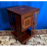 A GOOD QUALITY MAHOGANY INLAID REVOLVING BOOK CASE, with slated sides to the shelves along with a