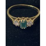 AN 18CT YELLOW GOLD EMERALD & DIAMOND THREE STONE RING