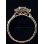 A PLATINUM THREE STONE DIAMOND CUT RING, radiant cut, the diamonds weight 1.40cts, colour E, size
