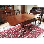 A FINE DROP LEAF SOFA TABLE, with rounded corners to the leaves and a single frieze drawer, raised