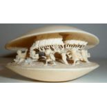 AN EARLY 20TH CENTURY CHINESE CARVED IVORY CLAM SHELL, Circa 1920 to 1940, with village scene to the