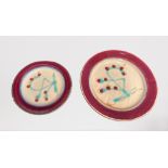 A SET OF TWO CONTEMPORARY CERAMIC DECORATIVE HANGING PLATES, large plate 15in, smaller plate 11in