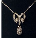 A VERY FINE 18CT WHITE GOLD EDWARDIAN STYLE DIAMOND BOW PENDANT, on an 18 inch white gold chain