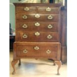 A SUPERB GEORGE II WALNUT & FEATHER BANDED CHEST ON STAND, the cross grain top moulding over an