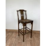 AN ANTIQUE HIGH STOOL, with wicker seat and brass detail, Approximate dimensions: Overall H