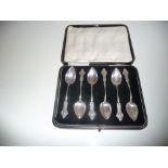 A LATE 19TH CNETURY CASED SET OF SCOTTISH SILVER SPOONS, Edinburgh, 1889, each with ornate tip and