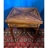 A GOOD QUALITY ROSEWOOD INLAID ENVELOPE FOLDING CARD TABLE, raised on tapered legs united by a
