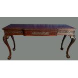 A GOOD QUALITY MAHOGANY HALL / SERVING TABLE, with carved edge over a breakfront frieze having