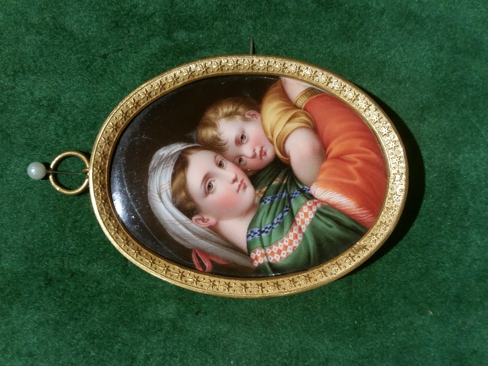 A 19TH CENTURY MINIATURE PORCELAIN PANEL, After Raphael, Madonna della Sedia, framed in a decorative