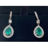 A STUNNING PAIR OF 18CT WHITE GOLD COLUMBIAN EMERALD & DIAMOND DROP EARRINGS, with two pear shaped