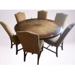 A CONTEMPORARY MAHOGANY CIRCULAR DINING TABLE on a platform down swept base, 5ft wide x 30in high