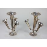 A pair of Edward VII silver epergnes, each with central trumpet shaped vase and three smaller held