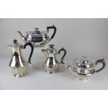 A silver plated circular teapot with demi-fluted decoration, an oval teapot, and two baluster shaped