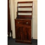 A George III mahogany secretaire waterfall bookcase, with three open shelves above fitted drawer and