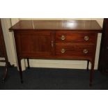 An Edwardian mahogany sideboard, with line inlaid rectangular top above a panel door enclosing