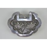 A Chinese white metal lock box, possibly for spices, with embossed design of mounted warriors and