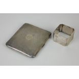A George V silver cigarette case, with engine turned decoration and engraved initials in central