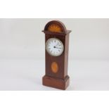 A miniature mahogany cased Smiths longcase clock, inlaid with batwing paterae, the circular white