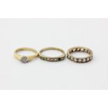 A white sapphire full hoop eternity ring, an illusion set diamond ring, a gem set half hoop ring