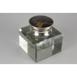 An Edward VII silver mounted square glass inkwell with circular tortoiseshell lid, maker Adie