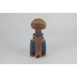 A 20th century Lisa Larson Gustavsberg Swedish pottery figure, 'Pelle', of a boy holding a cat,