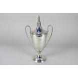 A George V neo-classical silver two-handled cup and cover on circular base, marks rubbed, Birmingham