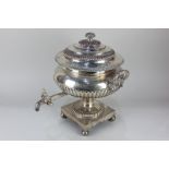 A silver plated samovar, circular pedestal form with demi-reeding, on square base and ball feet,
