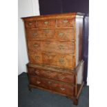 A George II walnut chest on chest, the top section with three short and three long drawers, on later