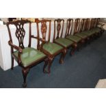 A matched set of ten Chippendale style dining chairs, comprising a set of six, including two