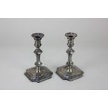 A matched pair of Victorian silver taper sticks, baluster shape on loaded bases, maker Hawksworth,