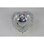 A Victorian silver heart-shaped dish with floral cast and pierced scroll border, raised pierced