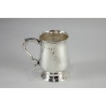 A George III silver mug, baluster shape with scroll handle and circular base, maker Peter and Anne