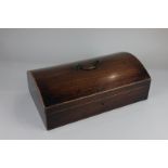 A 19th century mahogany stationary box with domed lid enclosing divided sections 34.5cm wide