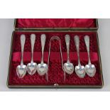 A set of six Victorian silver coffee spoons, and a pair of sugar tongs, with heart shape bowls and
