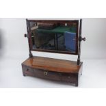 A Victorian mahogany dressing table mirror, the rectangular mirror plate with turned supports,