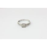 A diamond ring set with princess and brilliant cuts in white gold