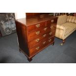 A 19th century mahogany chest of two short over three long drawers, with brass drop handles, on