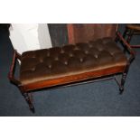 An inlaid mahogany duet piano stool, with turned supports and button upholstered lifting seat, on
