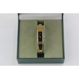 A lady's rolled gold Gucci bracelet watch