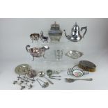 A silver plated sarcophagus shaped tea caddy, a small Queen Anne style teapot, sauce boat, two pairs