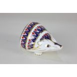 A Royal Crown Derby porcelain Hedgehog paperweight, in Imari colours, gilt stopper, 11cm