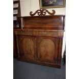 A Victorian mahogany chiffonier, the raised back with pierced scroll surmount and rectangular shelf,