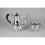 A Victorian silver coffee pot, baluster shape with scroll handle, 20cm high, and a matching two-