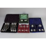 A cased set of twelve Victorian silver apostle teaspoons, and a pair of sugar tongs, in fitted case,